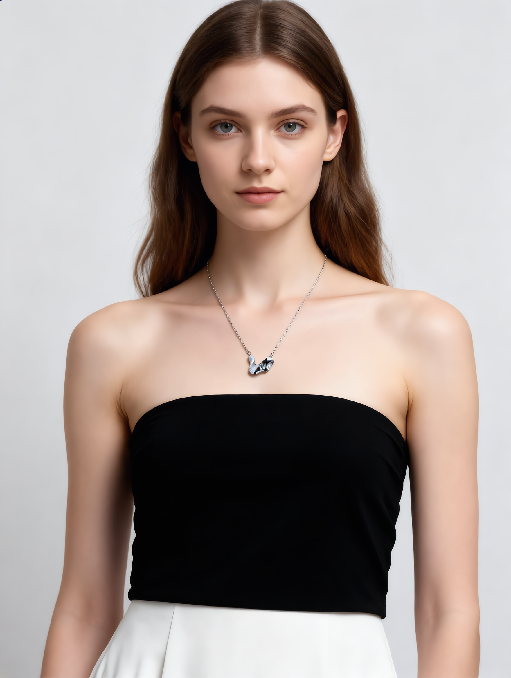 Sculpted Pause earrings worn by model