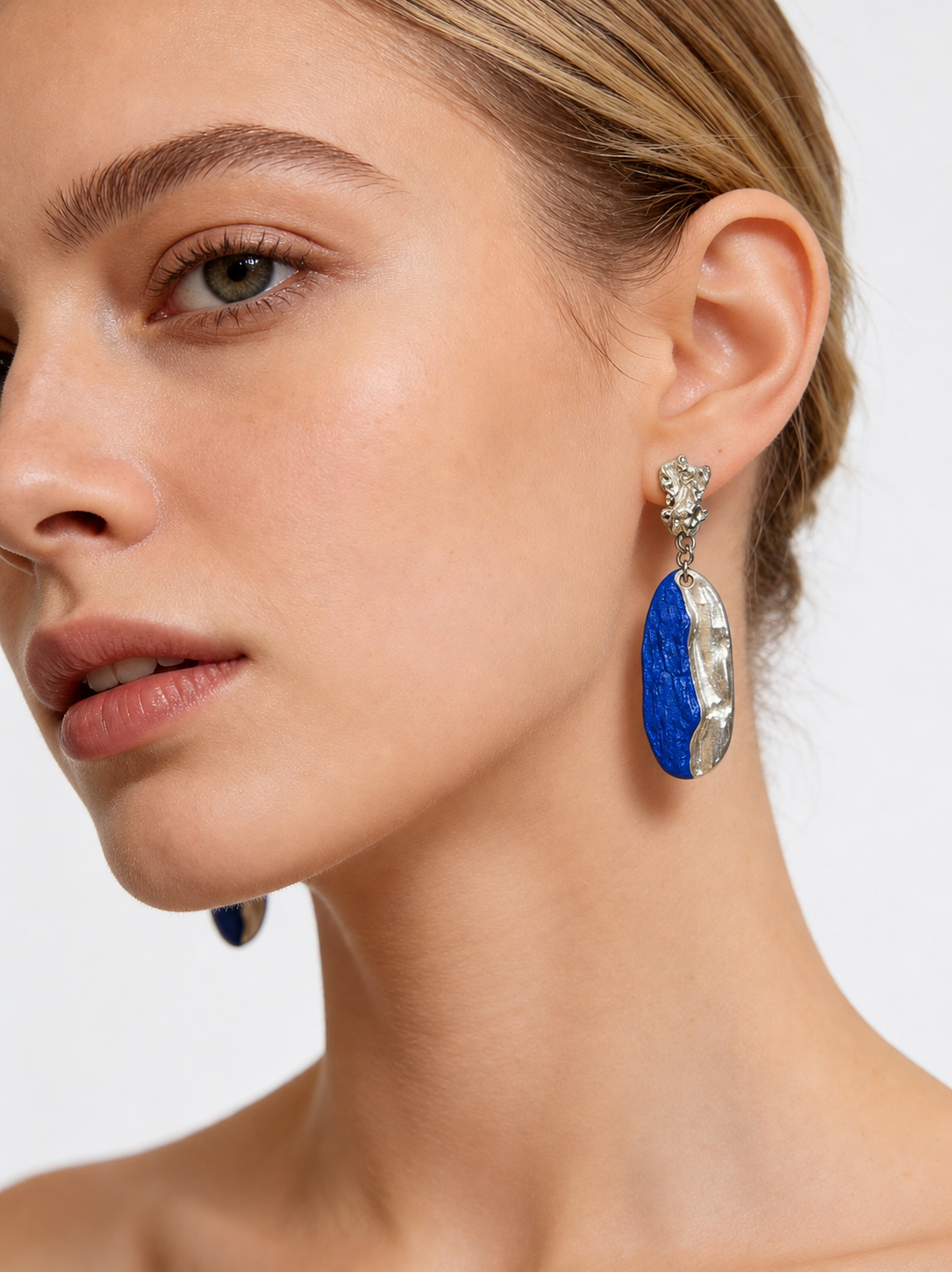 Ocean in Silver Spray earrings worn by model