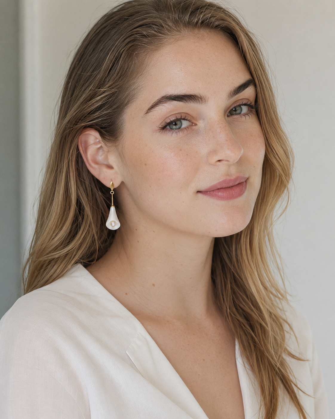 Ivory Blossom earrings worn by model