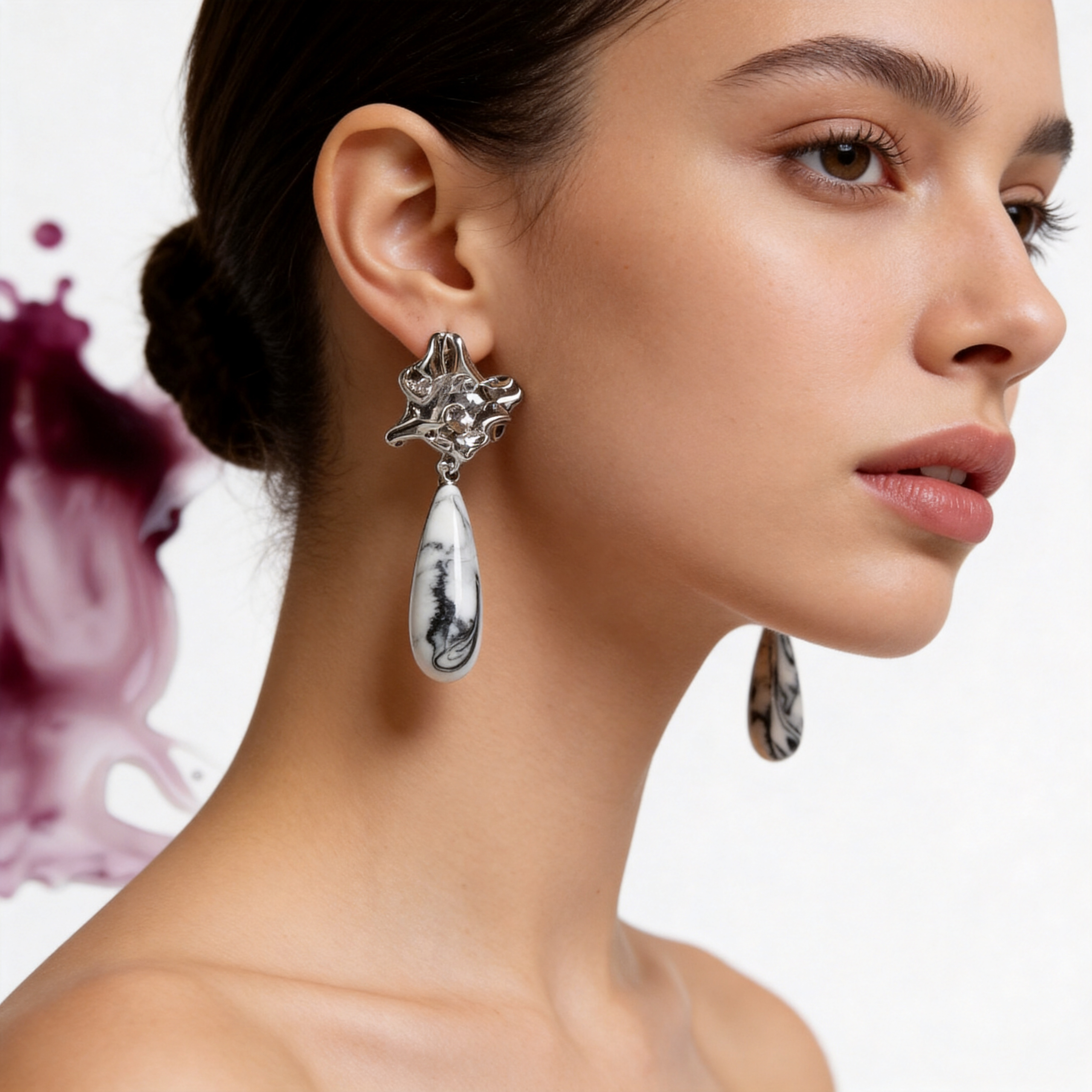 Profile view of Stillness in Form jewelry worn by model