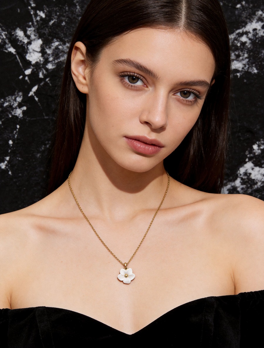 Floral Movement porcelain jewelry worn by model in soft editorial portrait