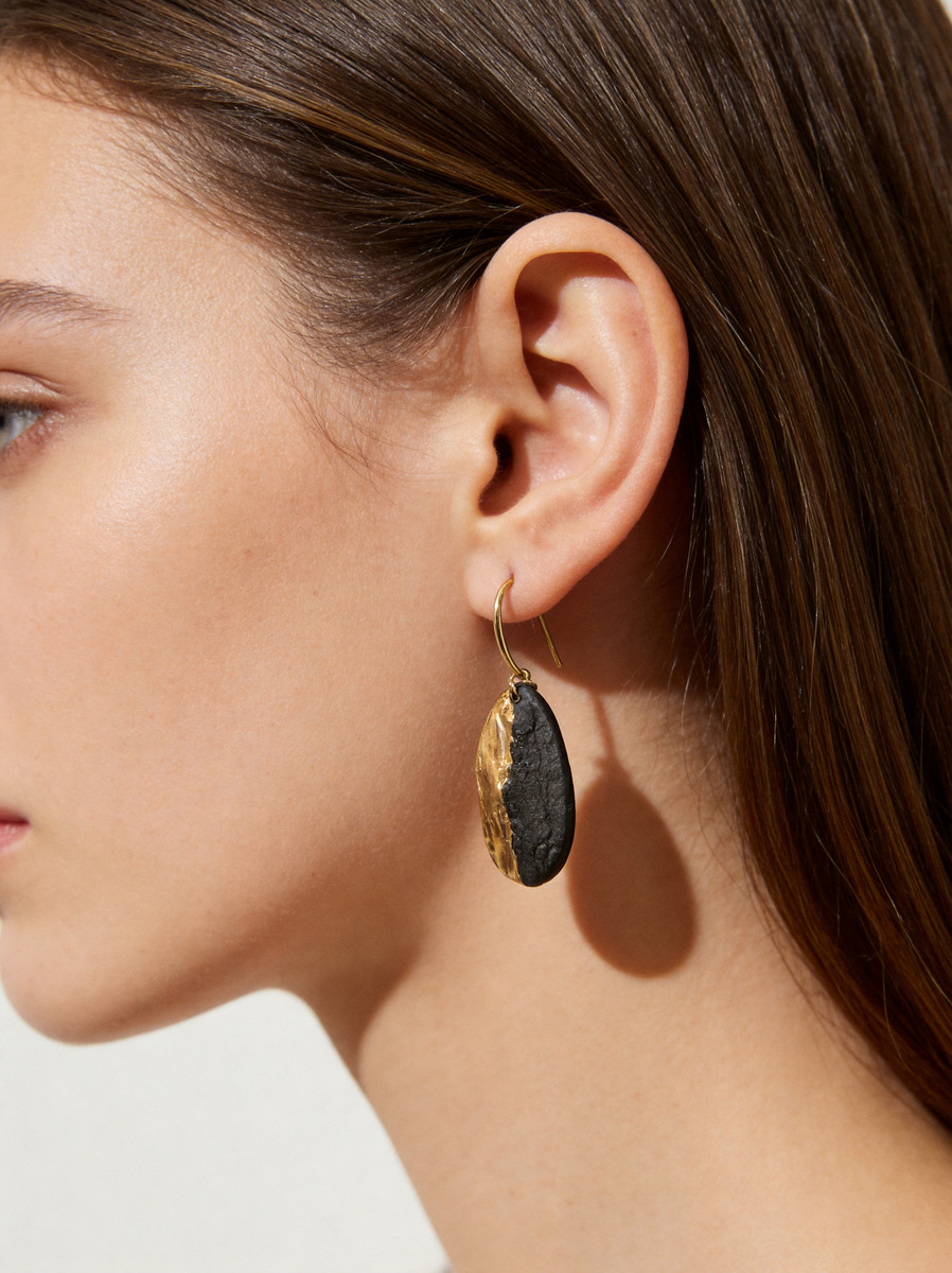 Obsidian Shore earrings worn by model